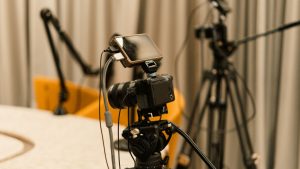 A professional studio with cameras, microphones, and other equipment ready for recording or live streaming.