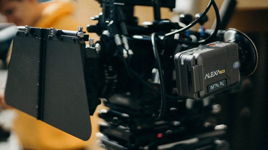 Close-up of a high-tech video camera setup used in professional videography.