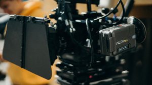 Close-up of a high-tech video camera setup used in professional videography.