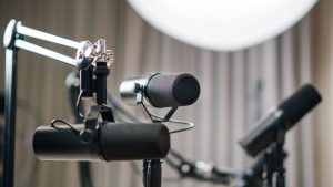 Close-up of dynamic microphones in a professional studio setting, ideal for podcasts and broadcasts.