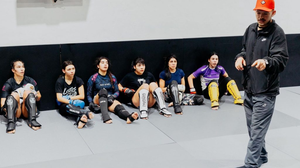 Group of women training in martial arts with their instructor in a Buenos Aires gym.
