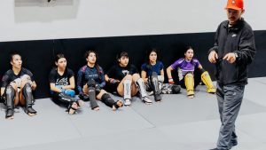 Group of women training in martial arts with their instructor in a Buenos Aires gym.